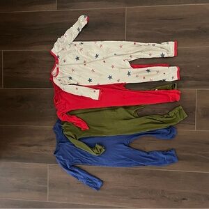 Kyte baby Bundle. Set of Four Baby Onesies in Red, Green, Blue, and Star Print